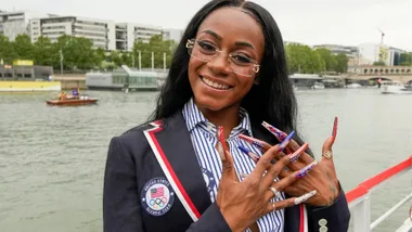 Sha'Carri Richardson poses for a photo while riding with teammates on a boat with teammates along the Seine River during the Opening Ceremony of the Olympic Games Paris 2024 on July 26, 2024 in Paris, France.