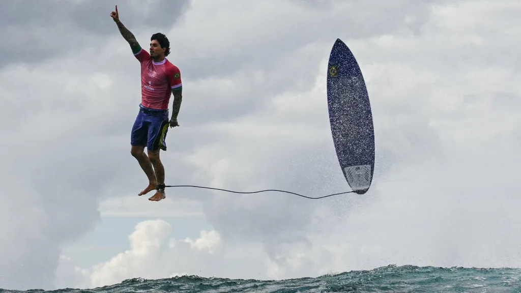 Gabriel Medina surfing in the Olympics. 