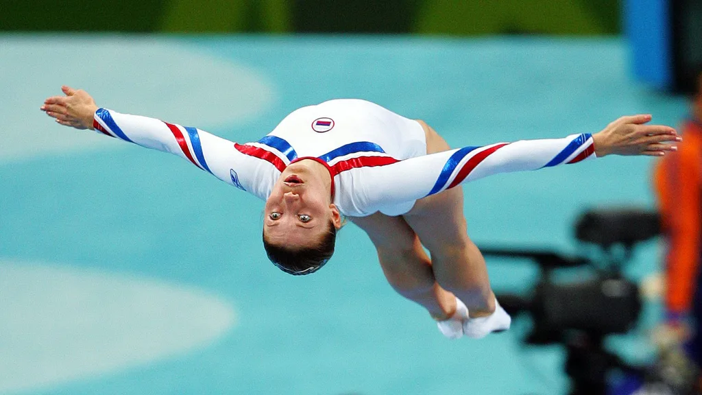 Irina Karavaeva of Russia performs her first routine in the gymnastics trampoline qualification at the Olympic Indoor Hall during the 2004 Summer Olympic Games in Athens. She placed 15th with a total score of 39.90.