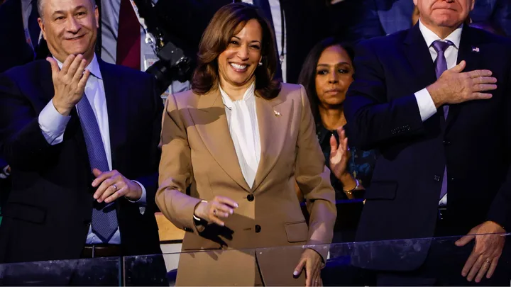 (L-R) Second Gentleman Doug Emhoff, Democratic presidential candidate, U.S. Vice President Kamala Harris, and Democratic vice presidential candidate Minnesota Gov. Tim Walz attend the first day of the Democratic National Convention at the United Center on August 19, 2024 in Chicago, Illinois. Delegates, politicians, and Democratic party supporters are in Chicago for the convention, concluding with current Vice President Kamala Harris accepting her party's presidential nomination. The DNC takes place from August 19-22.