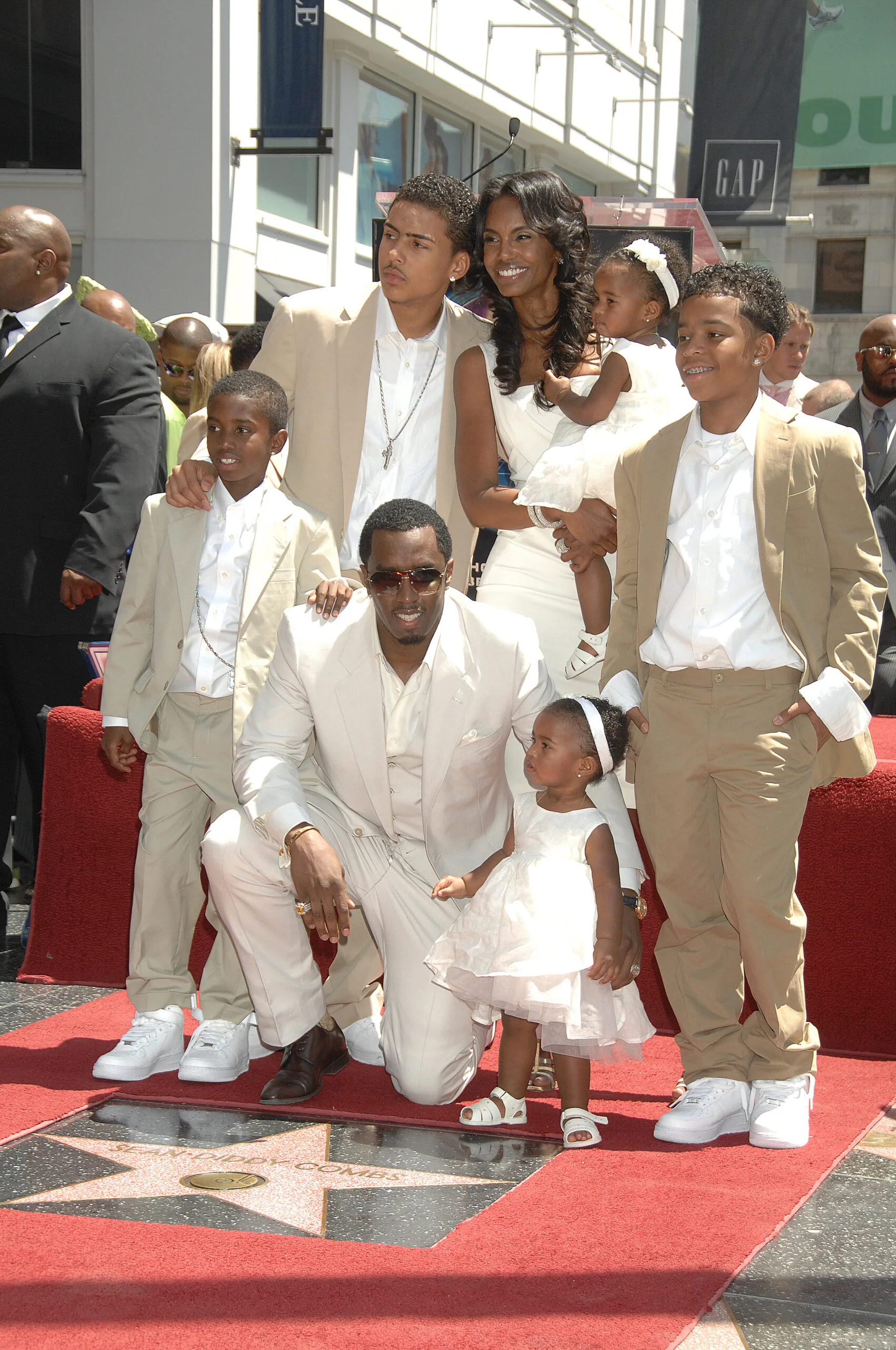 Sean Diddy Combs poses with his girlfriend, model Kim Porter and their children as Combs receives a star on the Hollywood Walk of Fame in Hollywood.