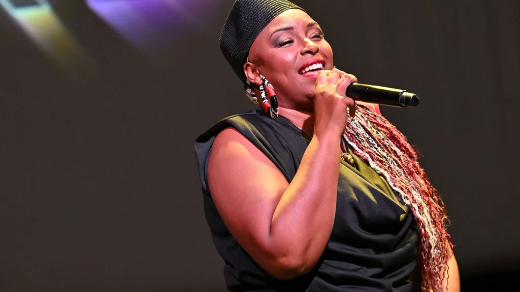 American singer Jaguar Wright on stage performing.