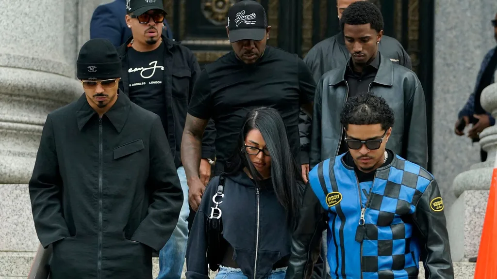 Justin Combs (R bottom) and Christian Combs (R, 2nd row), sons of rapper and music producer Sean "Diddy" Combs, leave federal court after their father's bail hearing