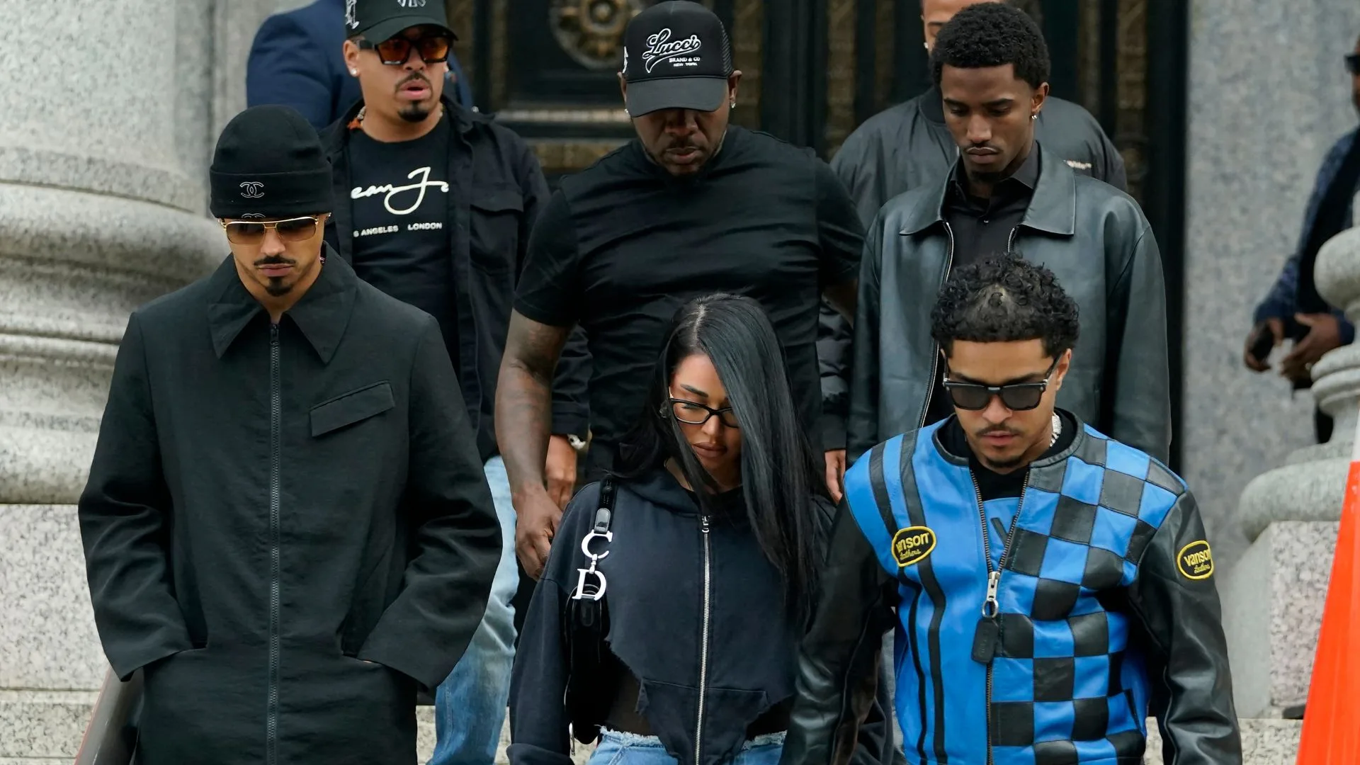 Justin Combs (R bottom) and Christian Combs (R, 2nd row), sons of rapper and music producer Sean "Diddy" Combs, leave federal court after their father's bail hearing 