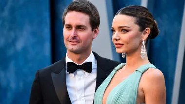 Evan Spiegel and wife Miranda Kerr posing on the red carpet