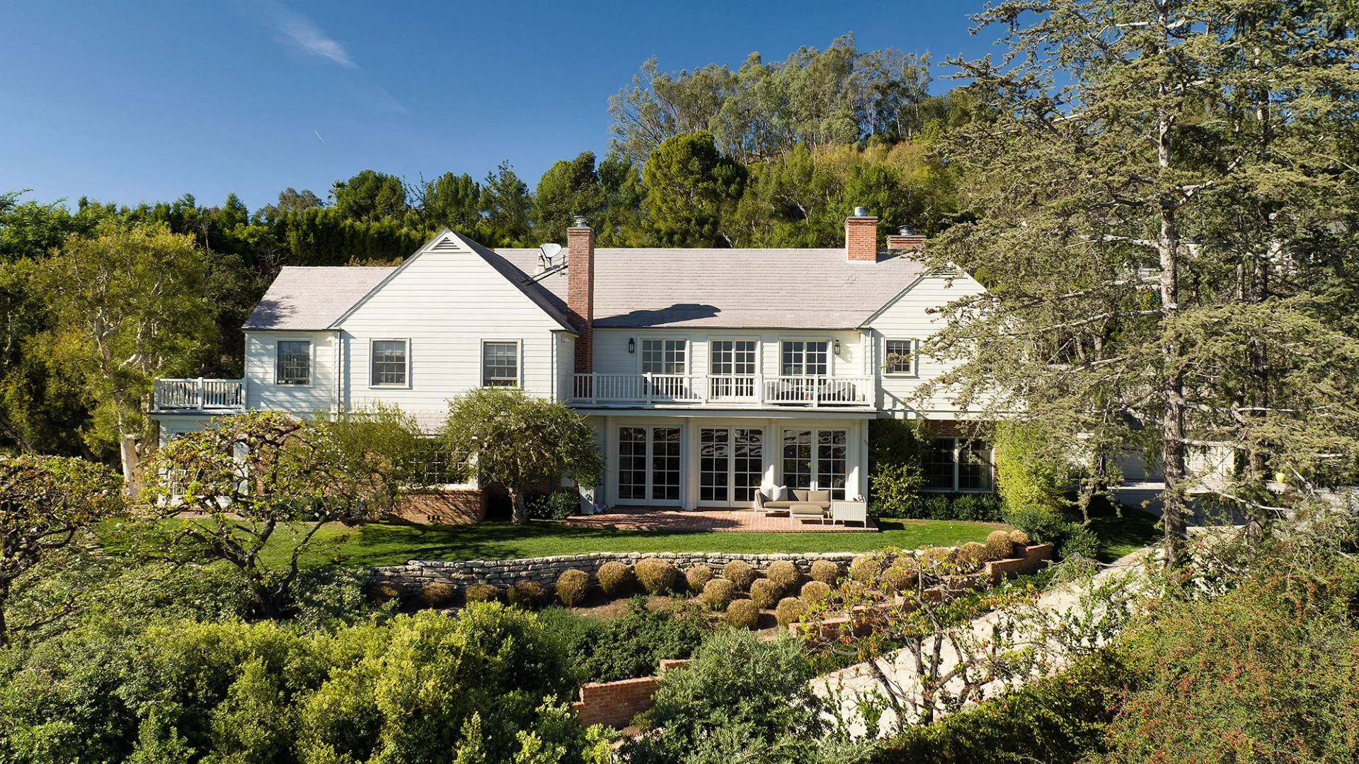 A landscape shot of the back of Miranda Kerr and Evan Spiegel's Hamptons-style Brentwood Home