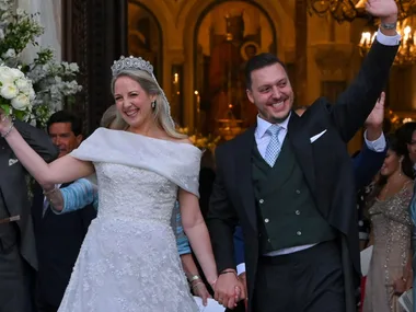 Princess Theodora daughter of former King of Greece Constantine II, and her husband Matthew Kumar leave the Athens' Orthodox Cathedral following their wedding ceremony at the Metropolis Greek Orthodox Cathedral