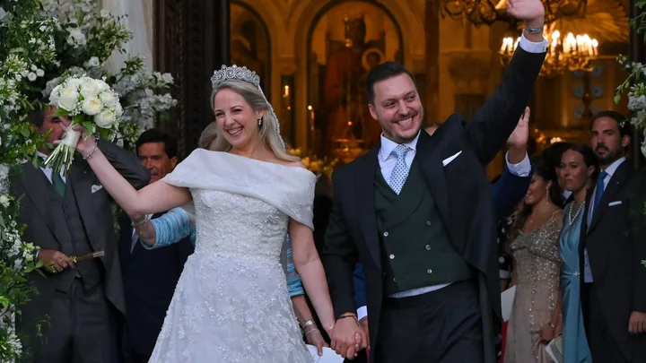 Princess Theodora daughter of former King of Greece Constantine II, and her husband Matthew Kumar leave the Athens' Orthodox Cathedral following their wedding ceremony at the Metropolis Greek Orthodox Cathedral