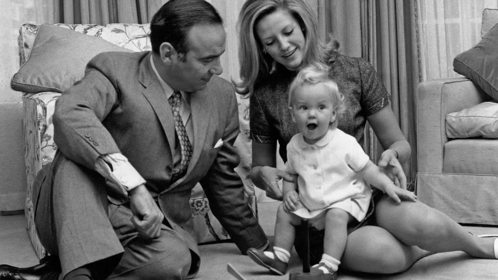 A black and white photo of Rupert Murdoch with his second wife Anna Maria Torv and their baby daughter Elisabeth at their home in Sussex Gardens, London 1969