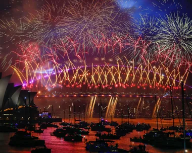 Fireworks light up the sky over the Sydney Harbour Bridge and the Sydney Opera House during New Year's Eve celebrations on January 01, 2024 in Sydney