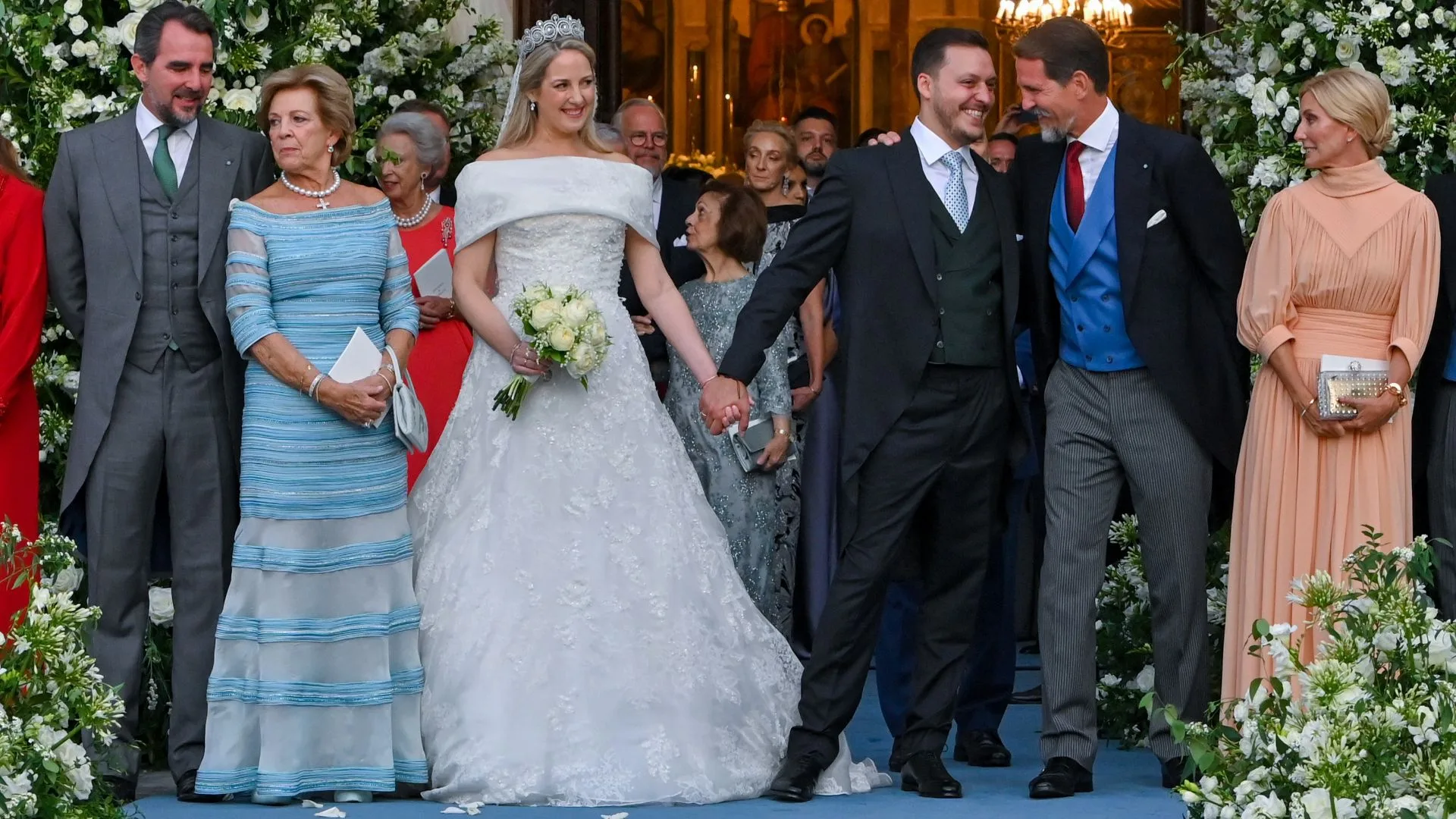 Theodora of Greece and Matthew Kumar leave the Metropolis Greek Orthodox Cathedral where they were married. The couple is pictured with the Princess' mother, uncle, brother and sister outside the Orthodox church.