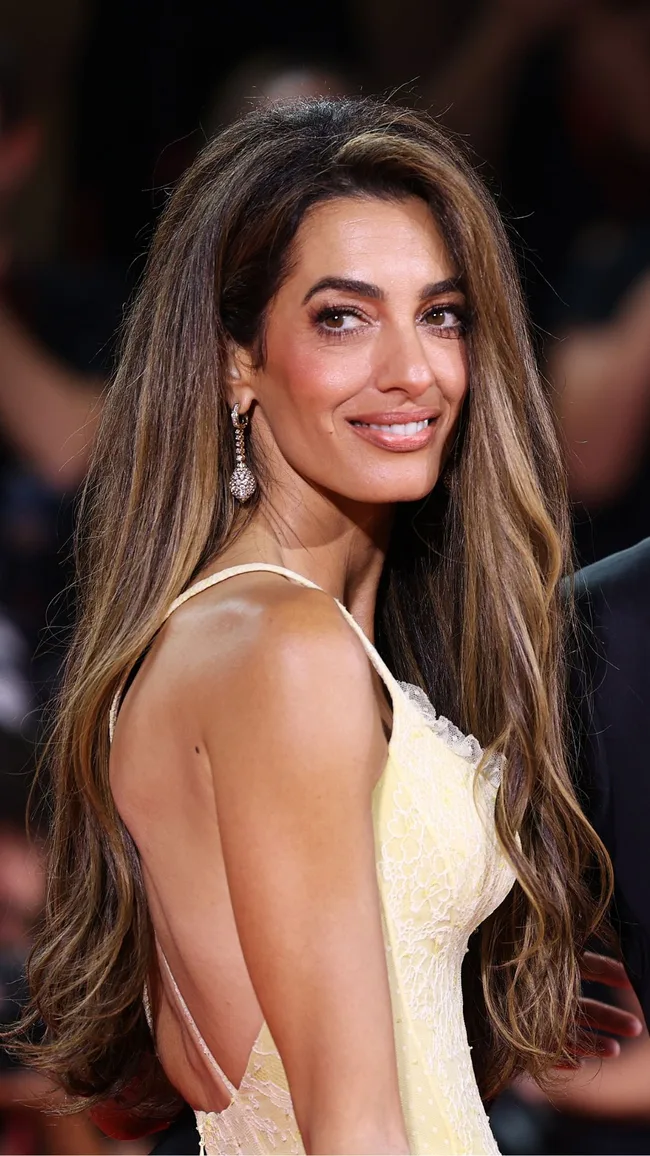 Amal Clooney and George Clooney attend the "Wolfs" red carpet during the 81st Venice International Film Festival on September 01, 2024 in Venice, Italy.