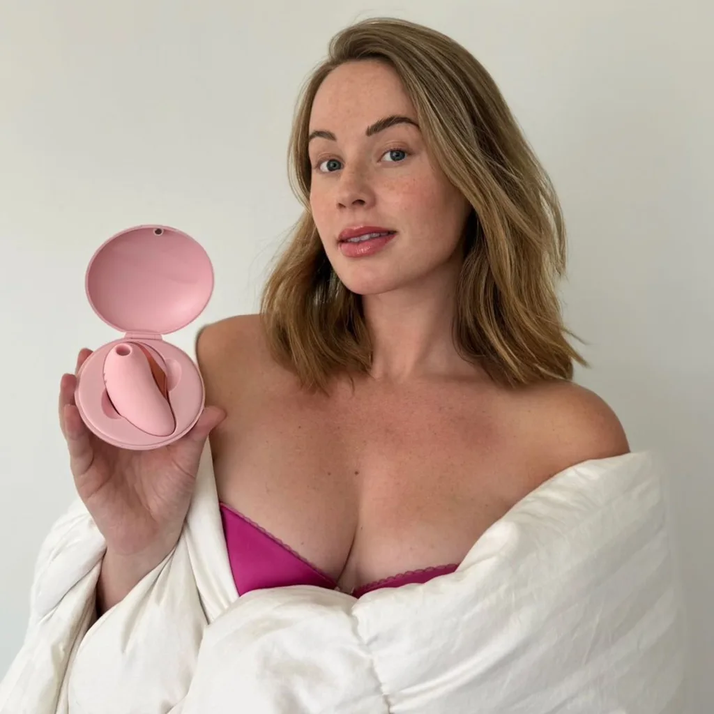 Whitney Leavitt posting to her instagram with a vibrator