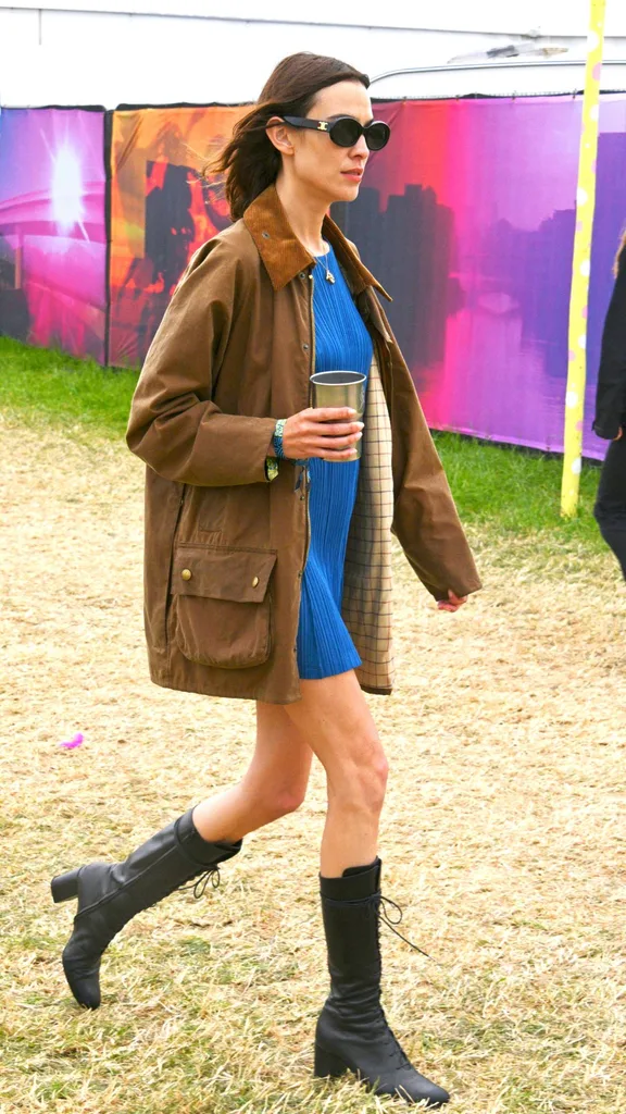 Alexa Chung is seen on day one of the festival wearing her vintage Barbour jacket at Glastonbury 2022