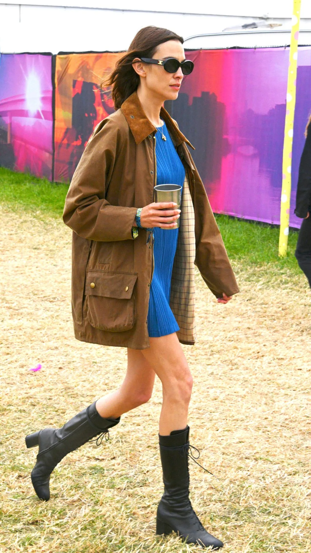Alexa Chung is seen on day one of the festival wearing her vintage Barbour jacket at Glastonbury 2022