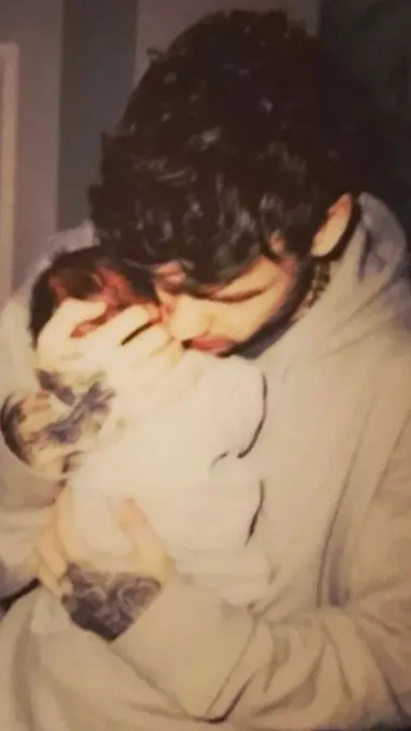 An instagram post from Liam Payne announcing the birth of his son, Bear. The singer is seen cradling his baby and holding him to his chest.