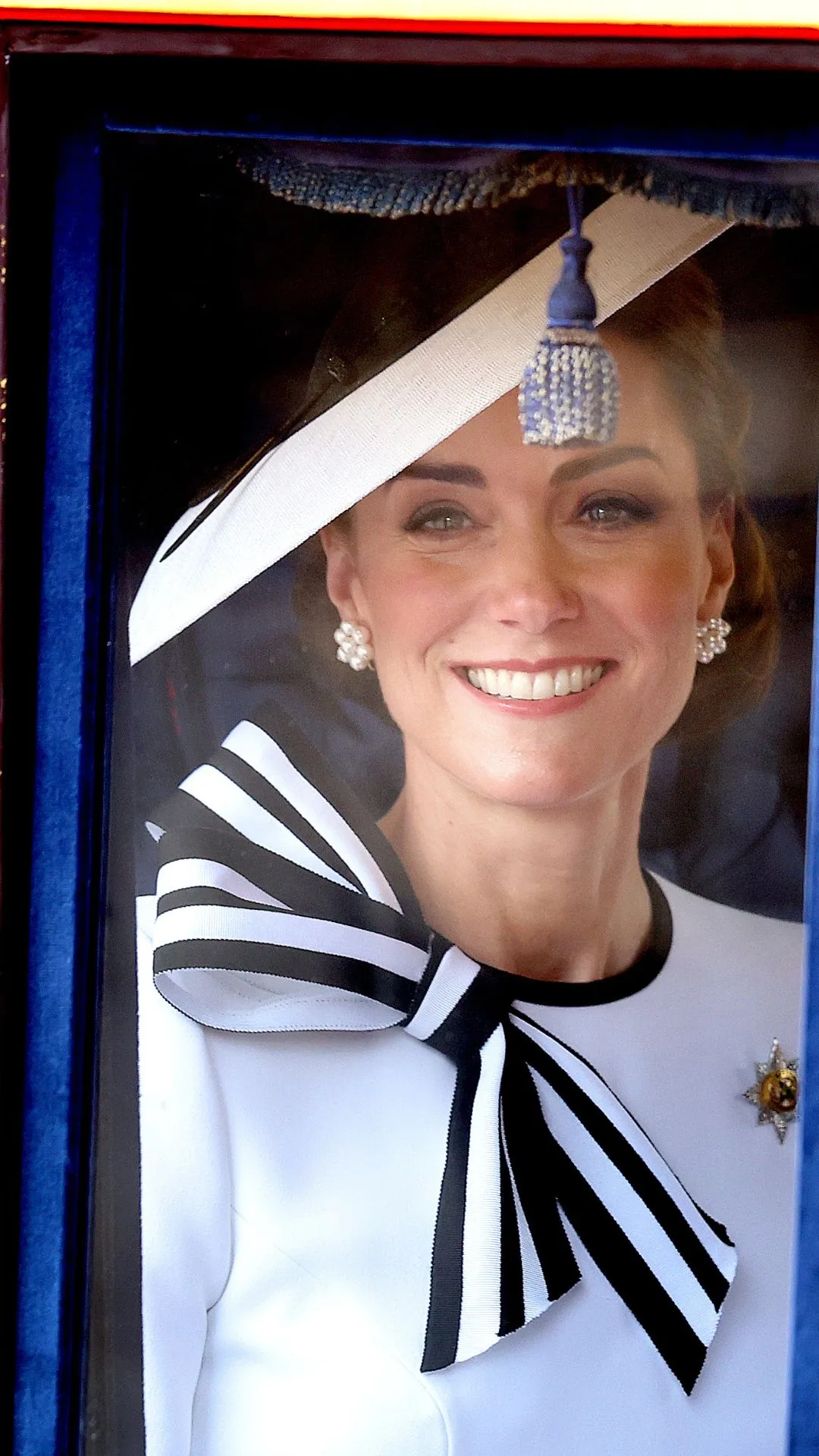 Catherine, Princess of Wales smiles as she travels by carriage during Trooping the Colour at Buckingham Palace on June 15, 2024