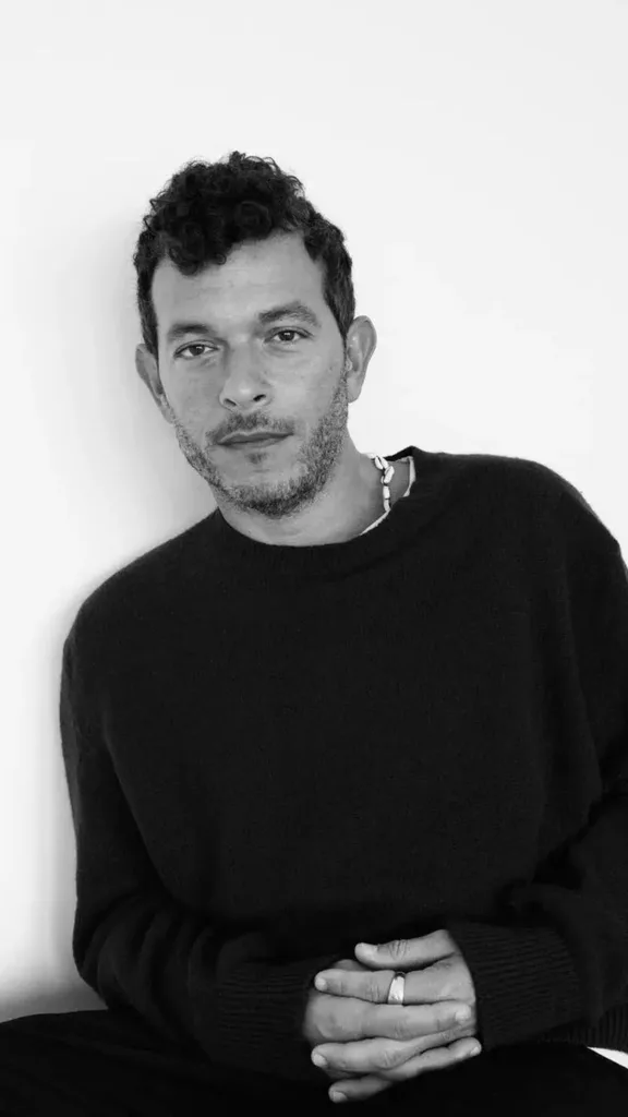 A black and white portrait of Michael Rider