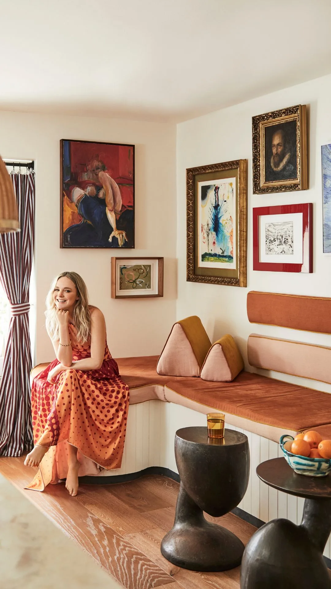 Nadia Fairfax home sitting area banquette and art wall