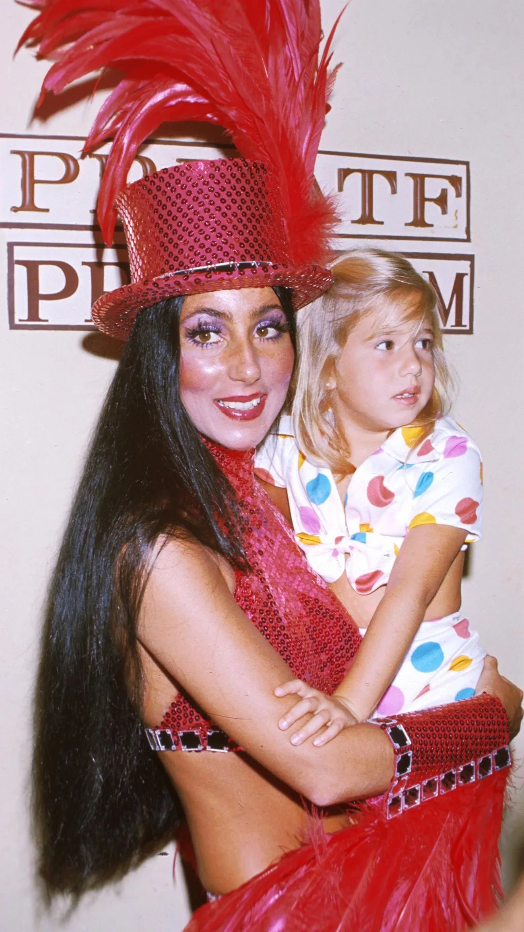  Cher performs as ringmaster at the opening day of the Ringling Brothers Circus as part of a celebrity event with her child 1974.