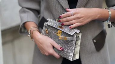 A guest carrying a Hermes bag during Paris Fashion Week