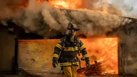 Firefighters work to put out a fire that broke out at the Altadena Golf Course Jan.09, 2025.