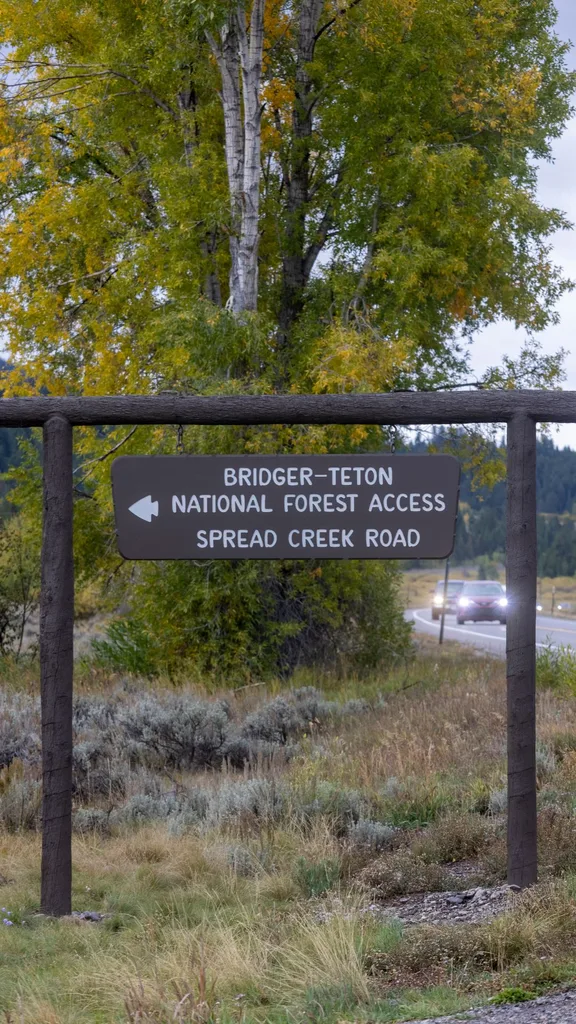 A sign leads the way to Spread Creek Campground on September 19, 2021 near Moran, Wyoming. Law enforcement searching the area for missing person Gabby Petito found an unidentified body.