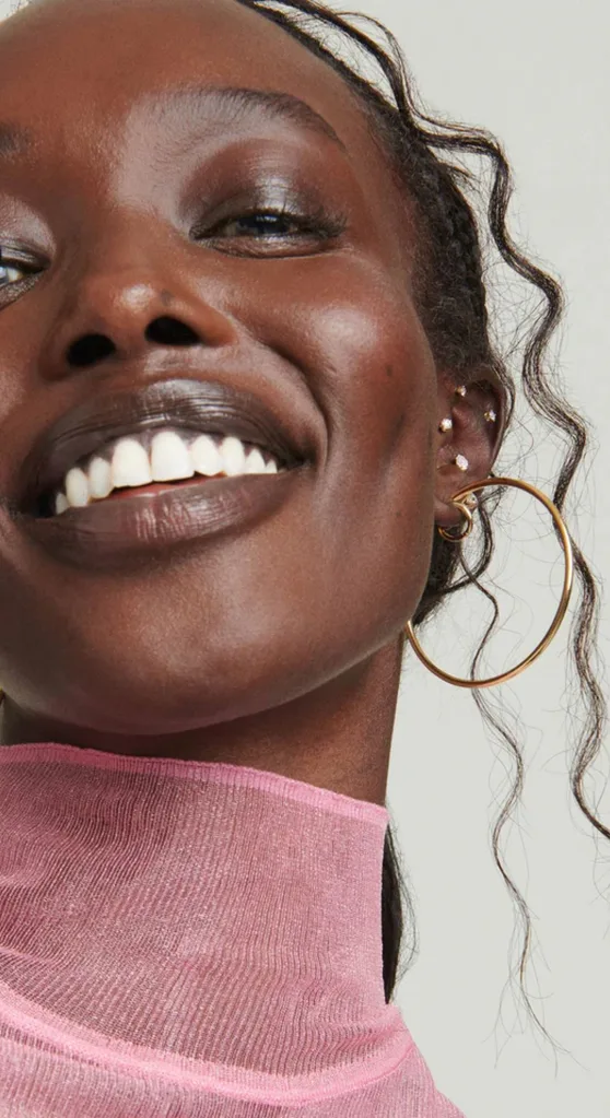 Person wearing gold jewellery