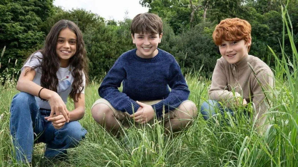 Three smiling children including actress Arabella Stanton who's set to play Hermione in the new Harry Potter series.