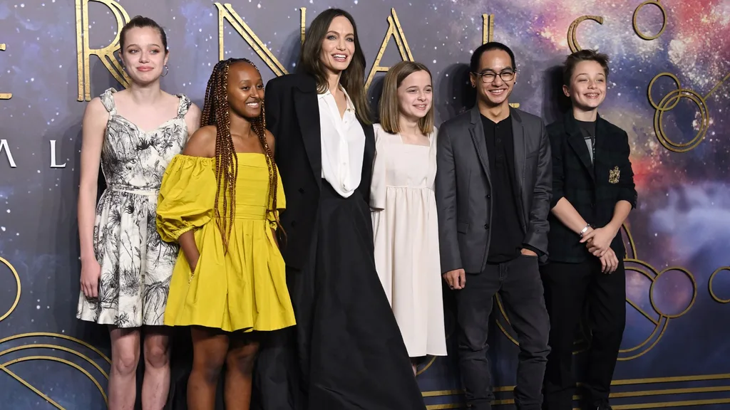 Shiloh Jolie Angelina Jolie children Eternals red carpet Dior dress.