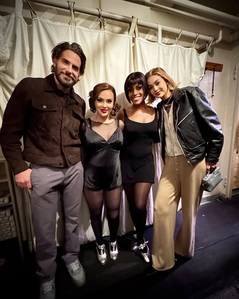 Bradley Cooper and Gigi Hadid pose with Alyssa Milano backstage at Chicago The Musical.
