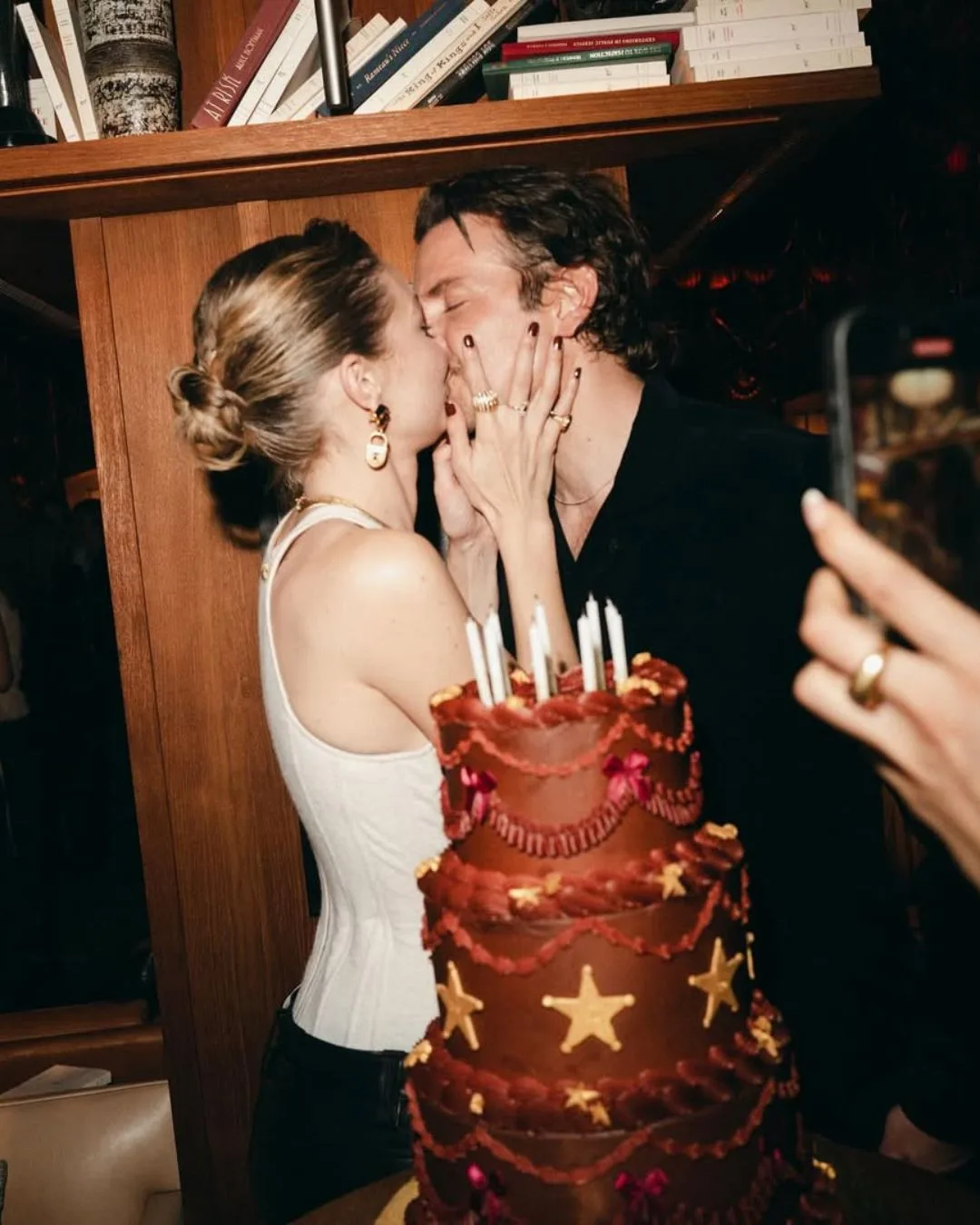 Gigi Hadid and Bradley Cooper celebrate her 30th birthday with a sweet kiss posted on social media. 