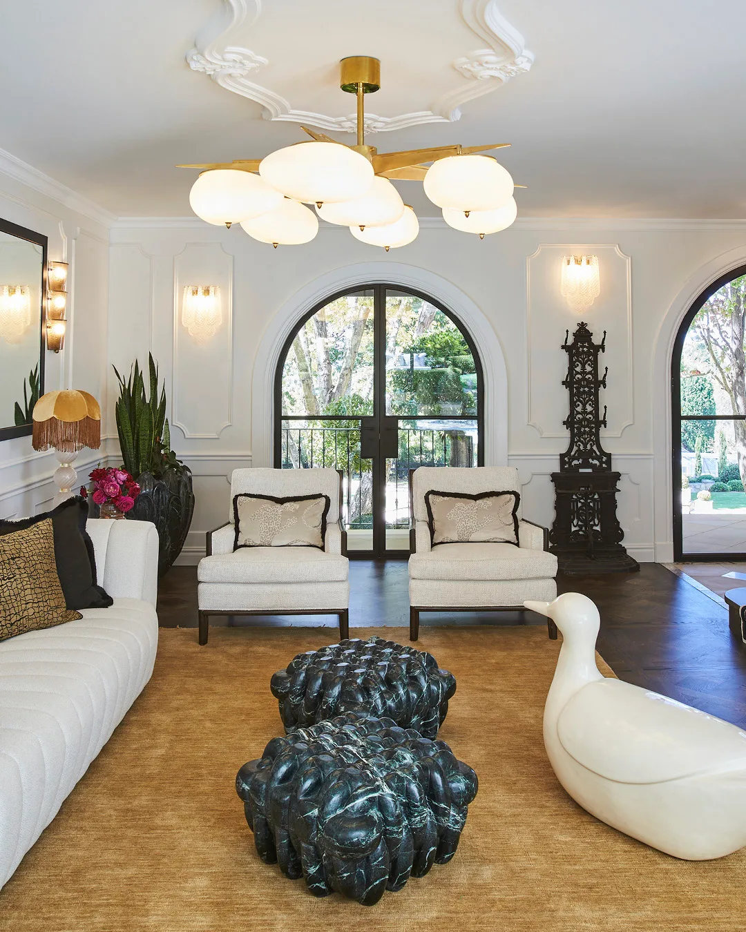 A living room with white sofas. 
