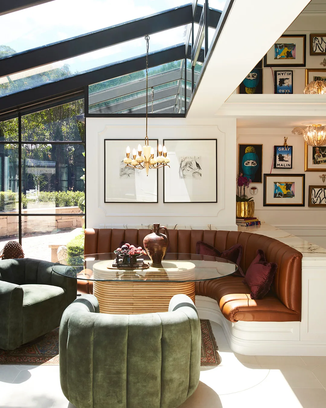 A living room with high glasshouse-style ceiling. 