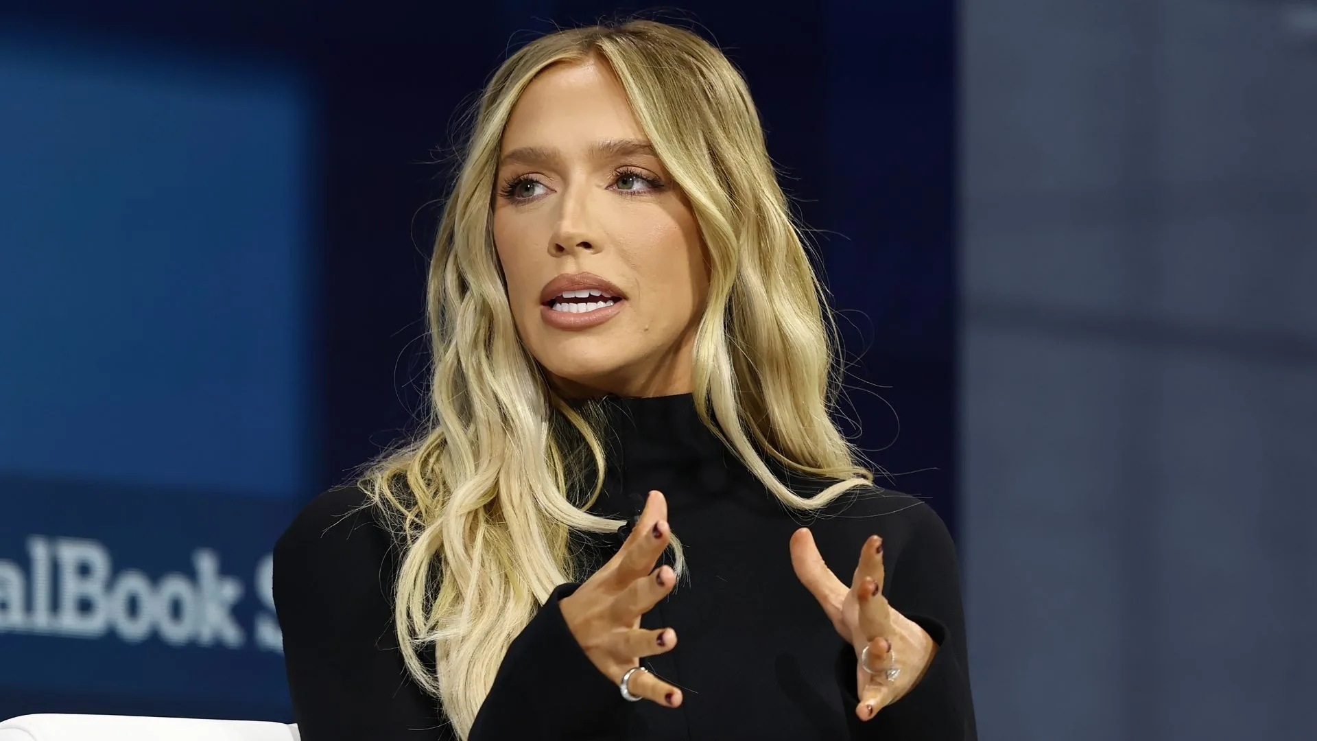 A blonde woman talking.