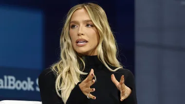A blonde woman talking.