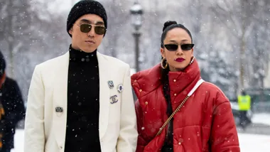 couple stand in the snow on the street