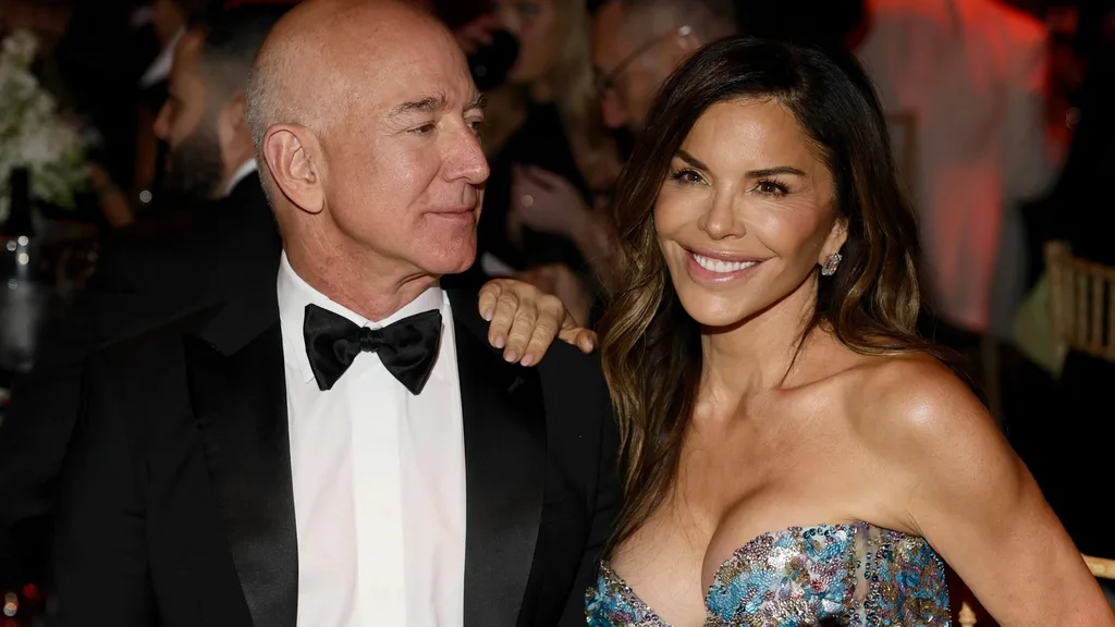 Lauren Sanchez and Jeff Bezos smiling.