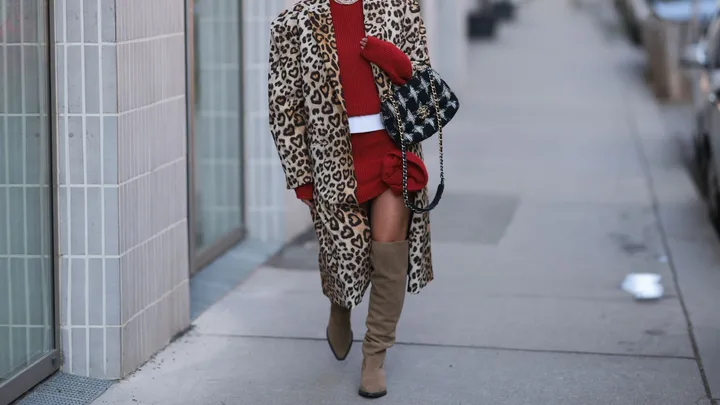 woman wears knee-high boots