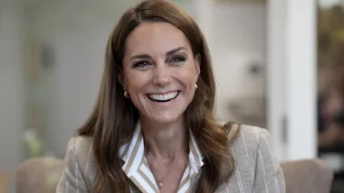 A woman smiling.