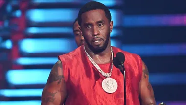 p diddy in red shirt on stage