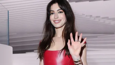 Anne Hathaway in a leather red dress