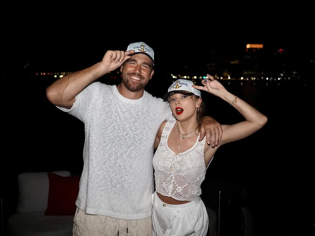 taylor swift and travis kelce pose with hats on instagram