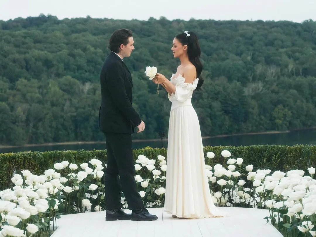 Nicola Peltz and Brooklyn Beckham saying their vows at their second wedding