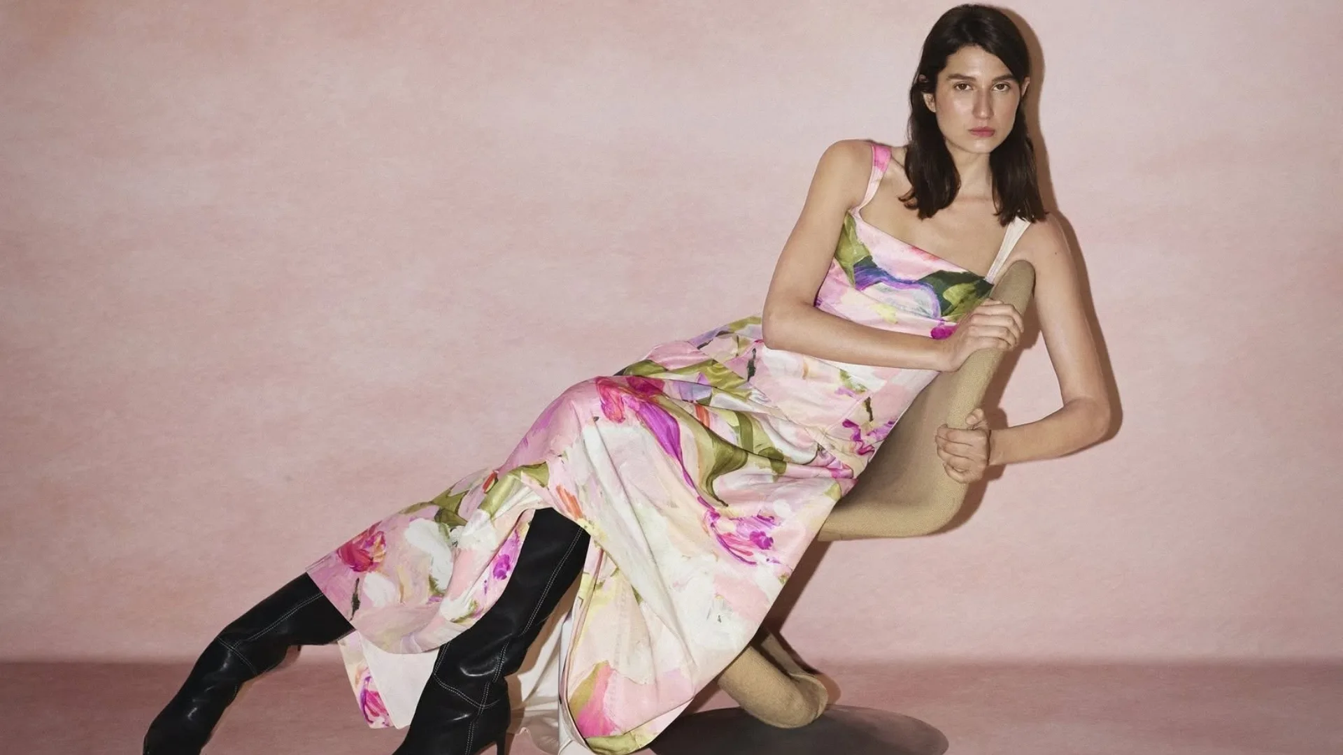 Model wears pink floral Acler wedding guest dress