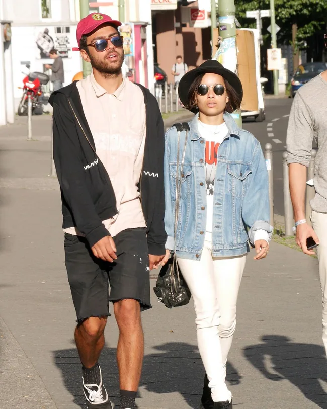 zoe kravitz and noah becker hold hands on a walk