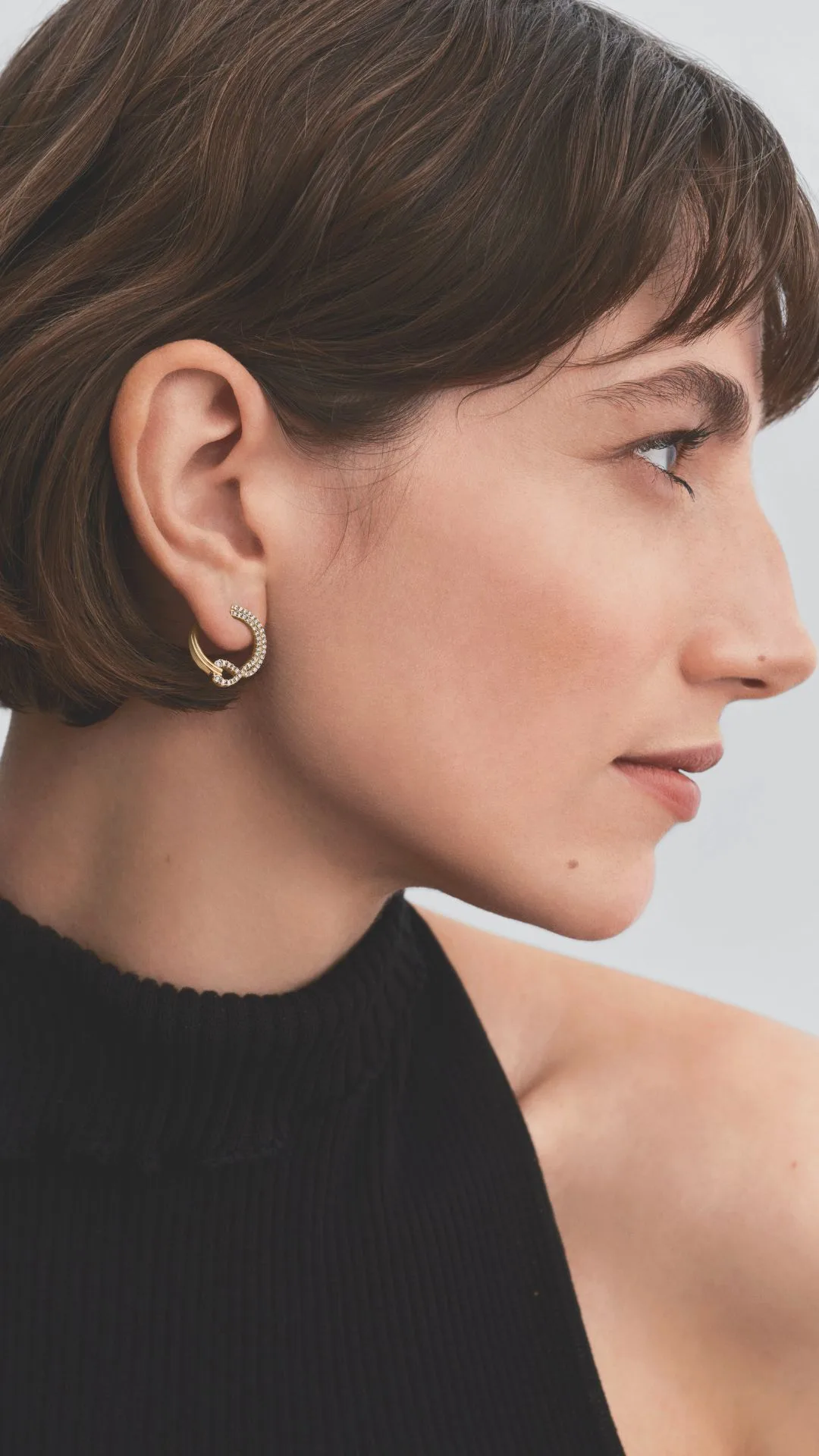 Model wearing Pandora Infinite Pave Collection earrings