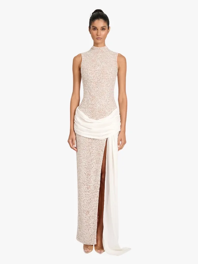 High neck sequinned column bridal dress with cream sash draped around hips