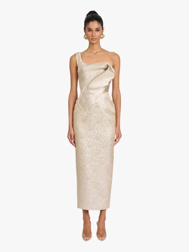 A gold, ankle-length wedding dress with a single strap