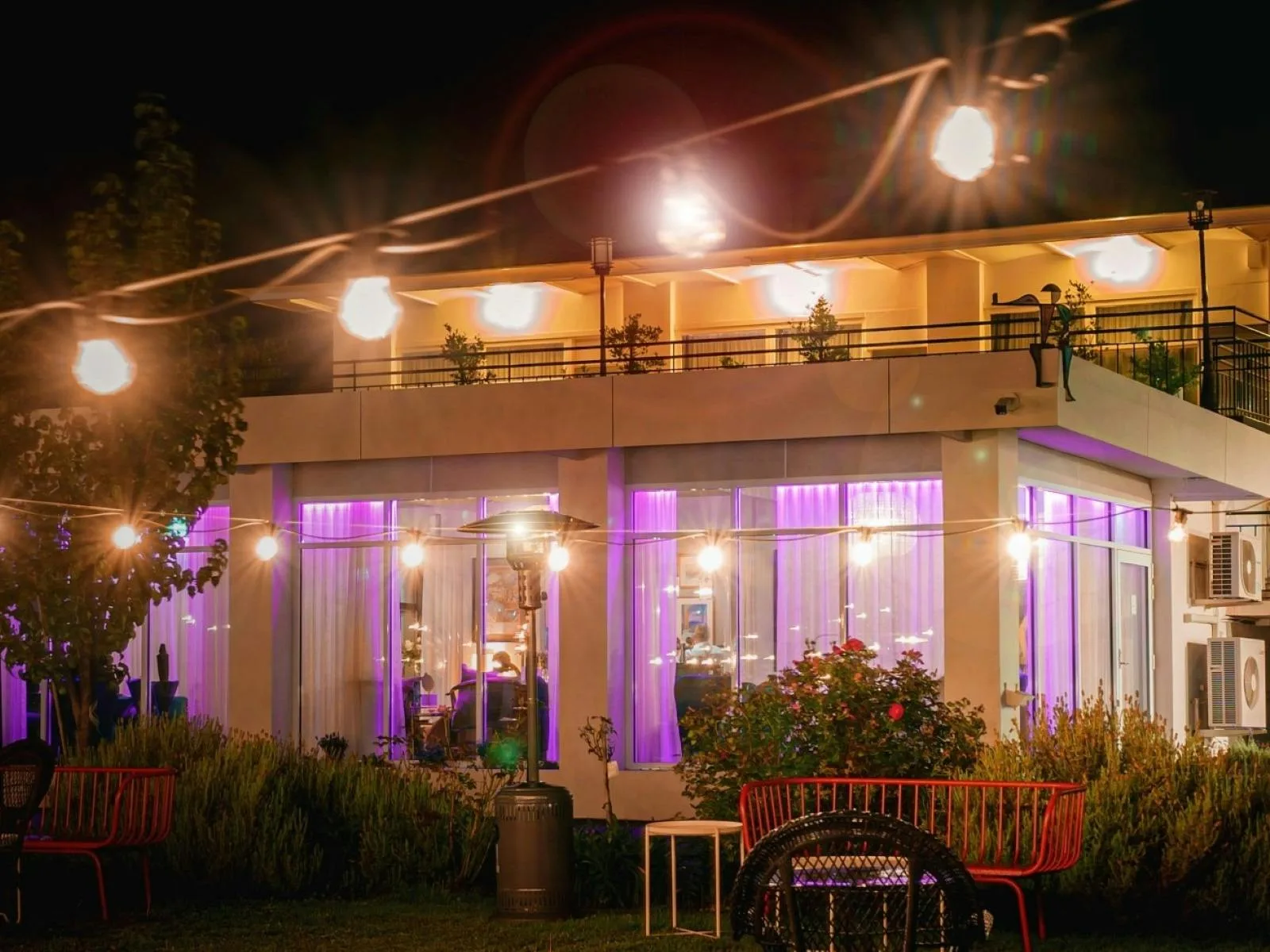 The Oriana by night - retro-chic vibes and glowing lights draw you into the Peacock Room and Bela Vista Bar.